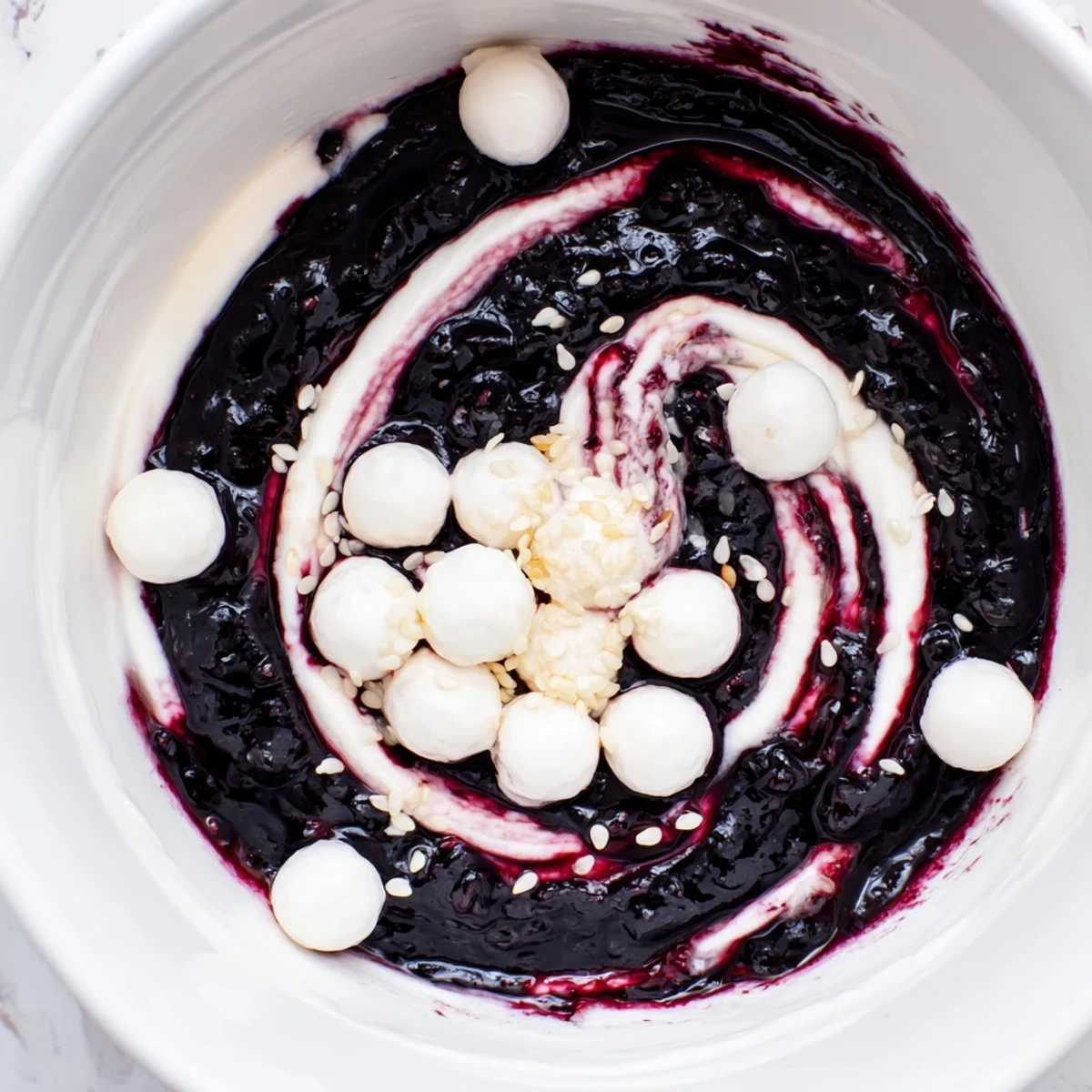 Enjoy the unique flavors of a Galaxy Spiral: creamy yogurt contrasted with dark berry, sesame and goat cheese.