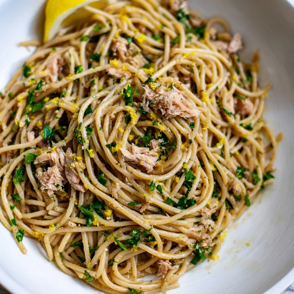 Close-up of bright Lemon-Garlic Tuna Spaghetti: a delicious, flavorful Italian pasta dish.