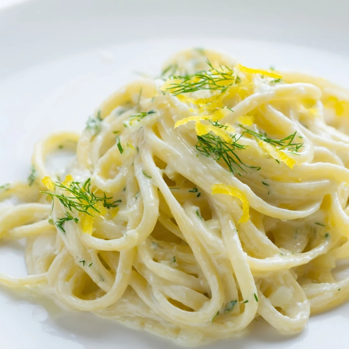 Creamy Dill Pasta swirled with fresh herbs and a rich, velvety sauce, ready to serve.