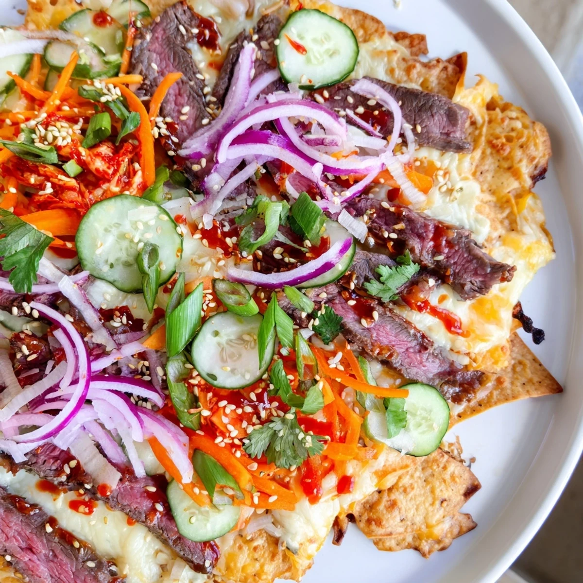 Golden Korean BBQ nachos, loaded with savory beef and melted cheese, ready to eat.