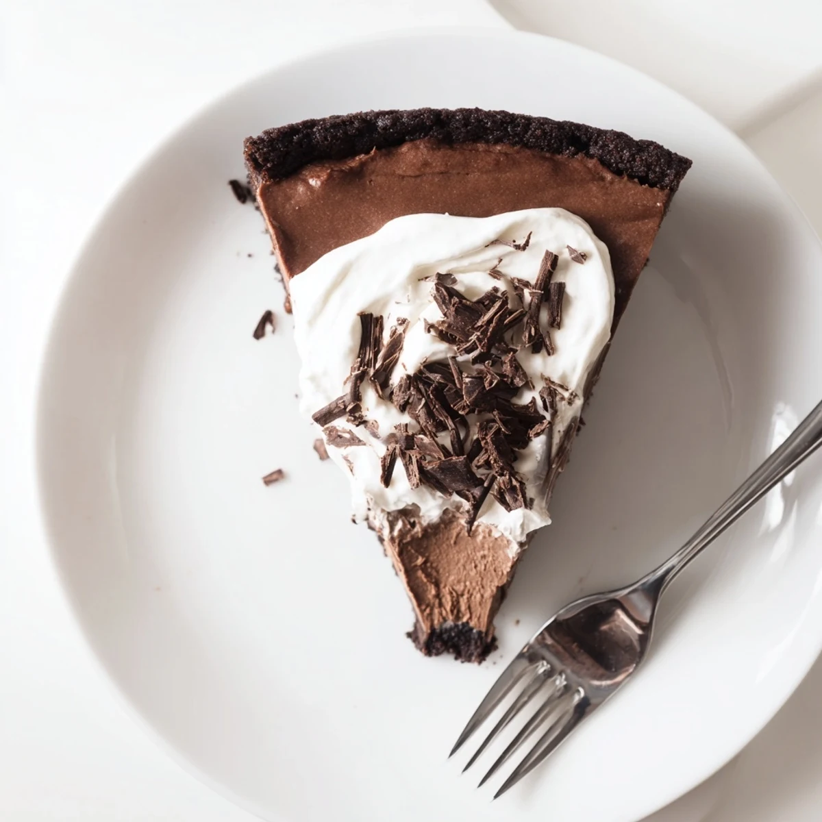 A moist, protein-packed Lighter Chocolate Cottage Cheese Cheesecake served with fresh berries for a bright, balanced dessert.