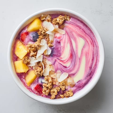 Smooth, creamy Breakfast Smoothie Packs, a perfect grab-and-go start with optional granola and coconut toppings.