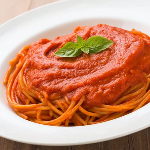 This vegetarian Hidden Veggie Tomato Pasta Sauce is a thick, aromatic blend of pureed vegetables simmered into a velvety tomato base perfect for cozy meals.  