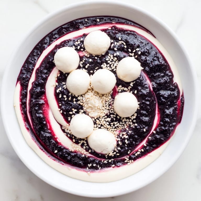 Imagine the Galaxy Spiral: a swirling pattern of berry jam, dotted with sesame seeds and goat cheese.