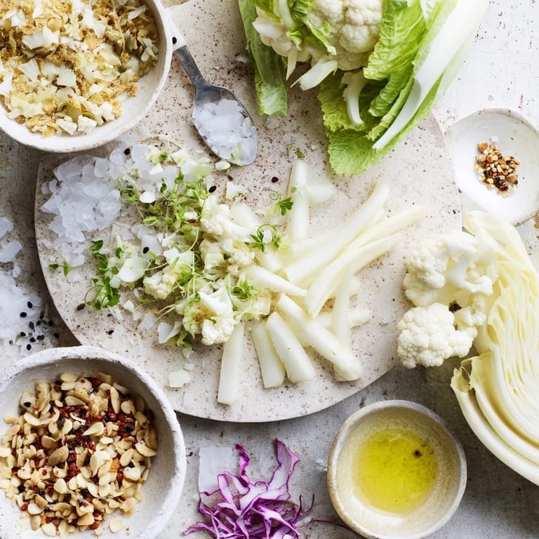 This artistic The Tundra Trek features finely chopped cauliflower, sesame seeds, and a light lemon dressing.