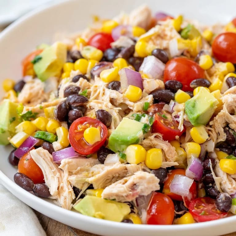 A tempting close-up of the flavorful Southwestern Bean Salad, brimming with fresh ingredients, ready to enjoy.