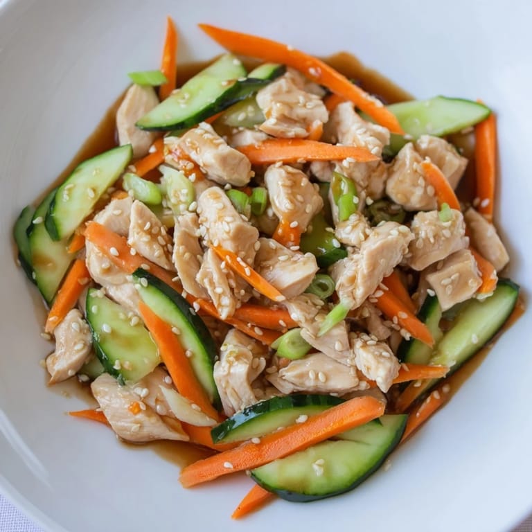 Get a close-up of the Deli Container Shaker Chicken Salad, highlighting the fresh, flavorful components.