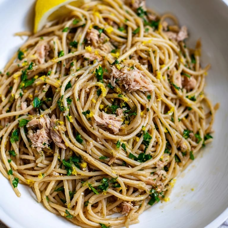 Close-up of bright Lemon-Garlic Tuna Spaghetti: a delicious, flavorful Italian pasta dish.