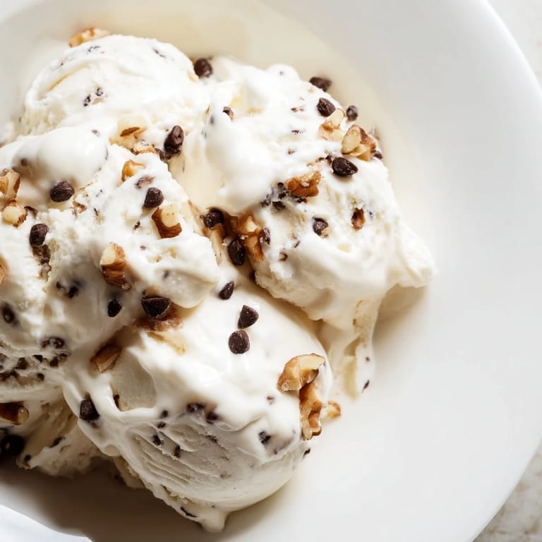 A scoop of homemade cottage cheese ice cream, showing its smooth, blended texture after freezing.