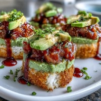 Golden crispy rice topped with vibrant spicy tuna and creamy avocado.